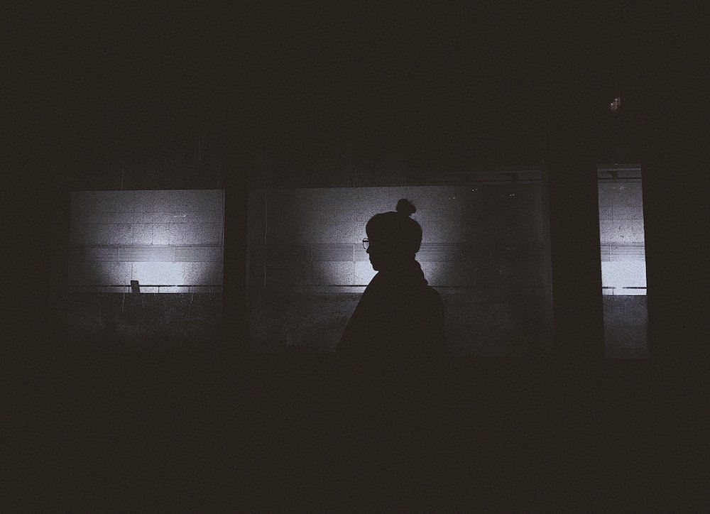 silhouette of person in room
