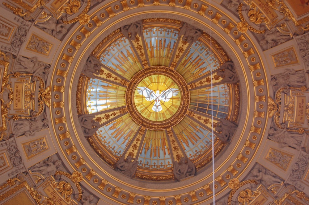 the ceiling of a building with a domed glass window