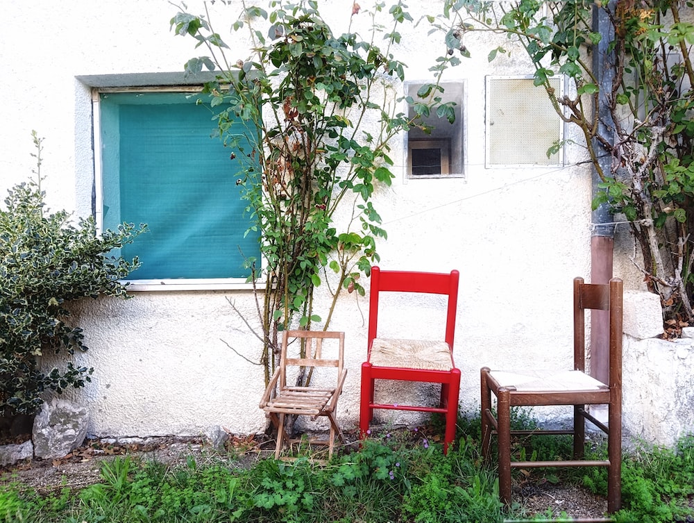 two chairs outside a house