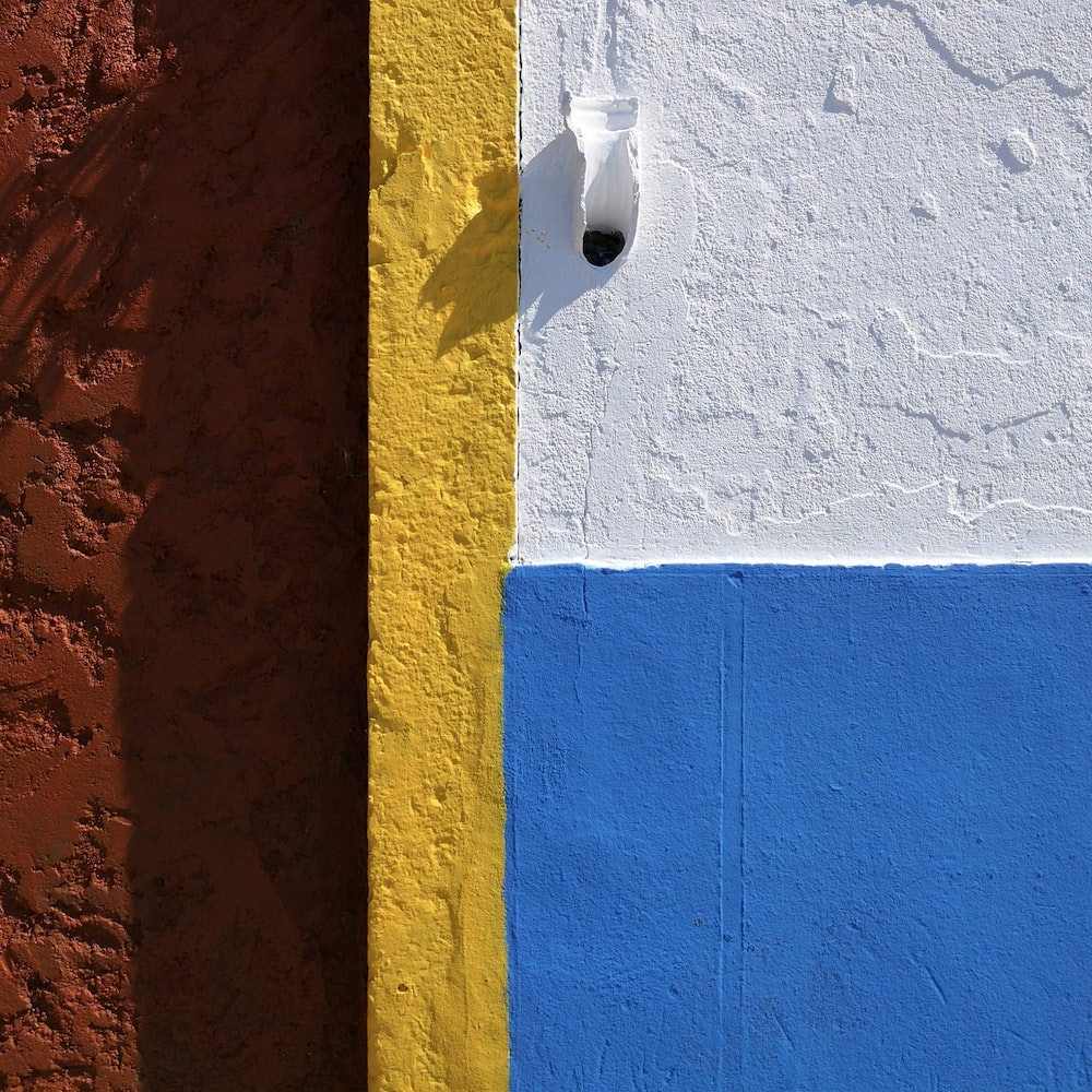 white,blue, and yellow painted wall