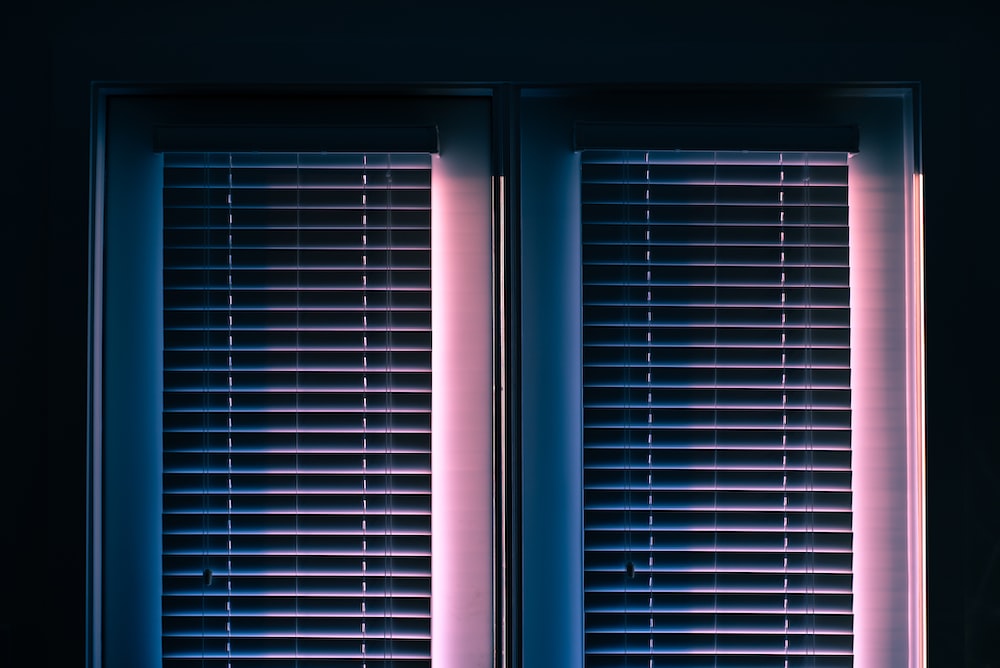 white window blinds closed